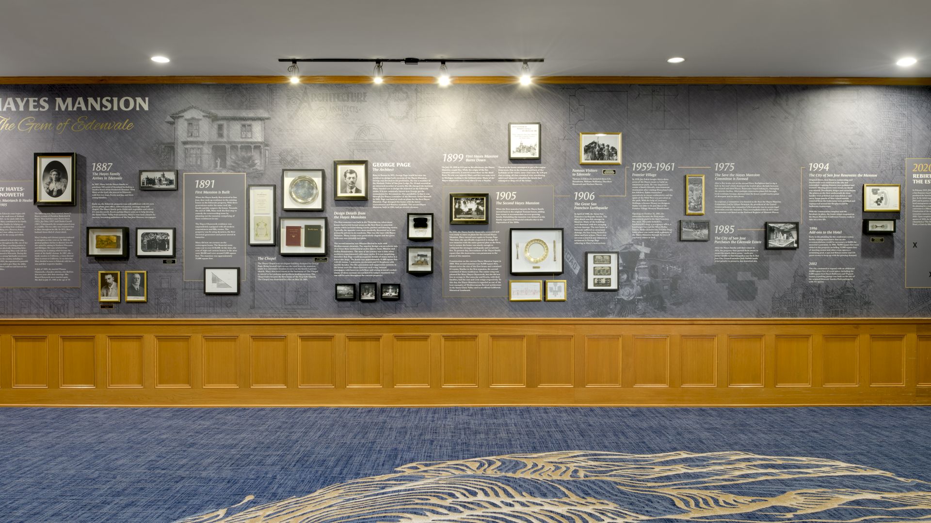 Exhibit wall titled &ldquo;Hayes Mansion&mdash;The Gem of Edendale&rdquo; with framed photos and a historical timeline from the late 1800s to 2020.