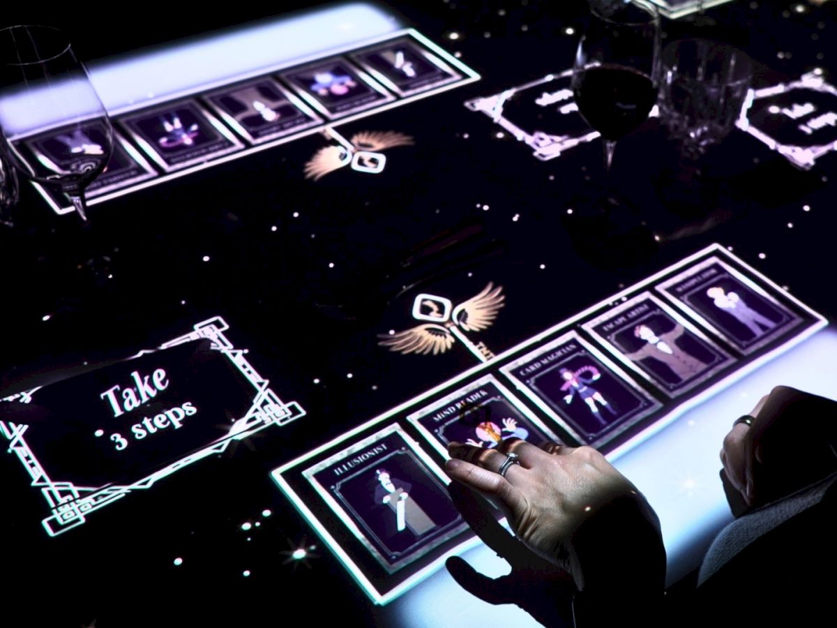 A magician&rsquo;s hand taps glowing cue cards and illusion icons on a holographic stage.